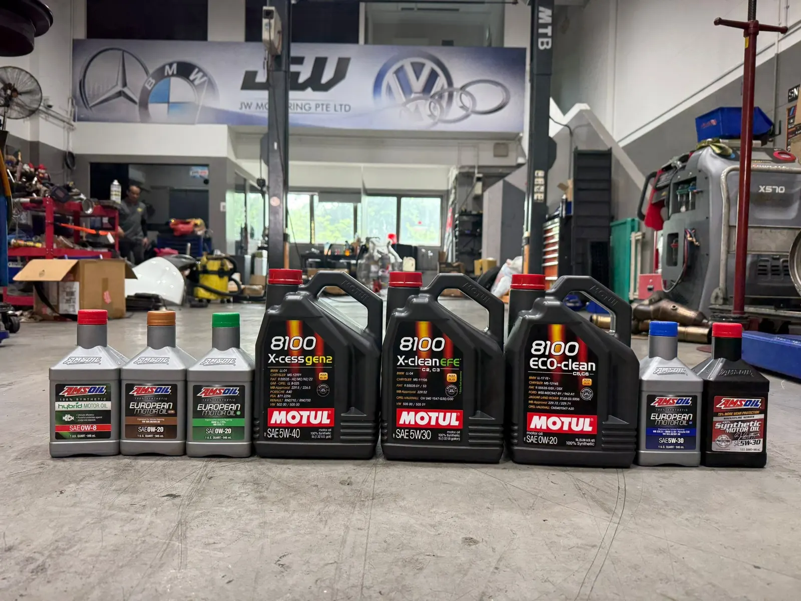 Motul and Amsoil servicing oils — correct grade before the pour